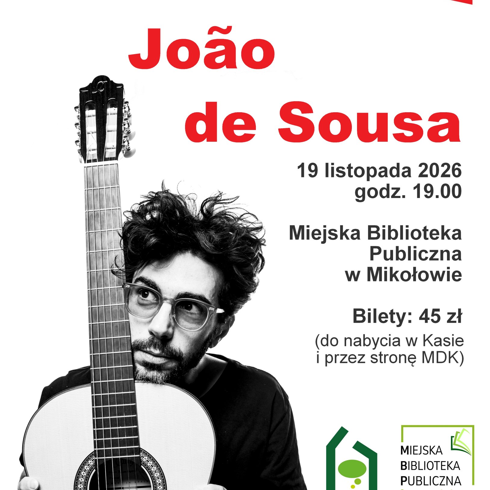 czarno-białe zdjęcie mężczyzny siedzącego za gitarą